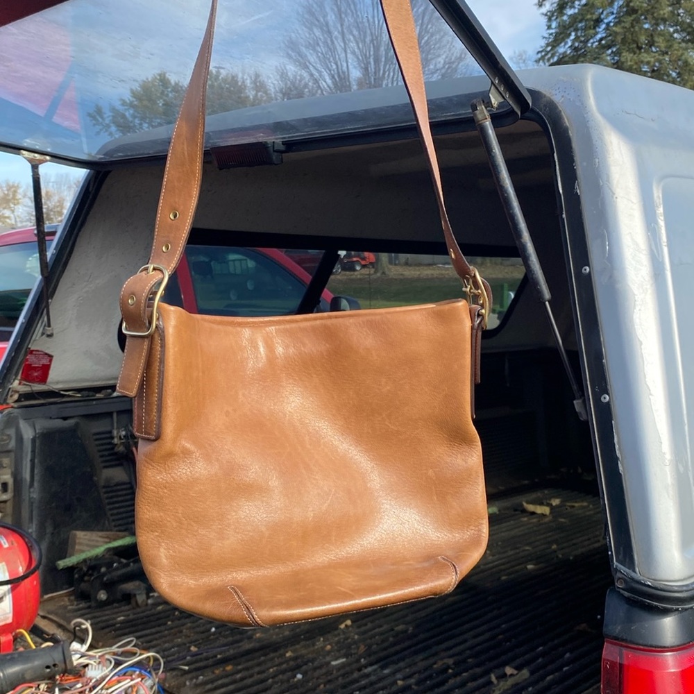 A beige Coach crossbody bag leather